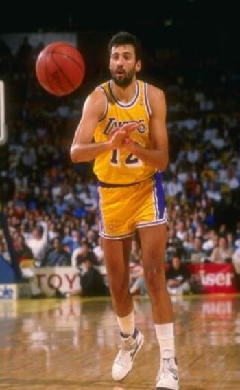 European Player Serbian Vlade Divac on the court in action with the ball in mid-pass