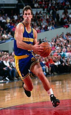 European Players photo of Sarunas Marciulionis in action on the court, running with the ball held with both hands in front